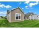 The backyard showcases the home's exterior, manicured lawn, and inviting outdoor space at 19123 River Jordan Pass, Westfield, IN 46074