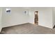 Bedroom with carpeted floors, two windows and doorway to bathroom at 19123 River Jordan Pass, Westfield, IN 46074