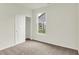 Bedroom featuring carpeted floors, neutral walls, a closet, and a window view of the neighborhood at 19123 River Jordan Pass, Westfield, IN 46074