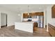 Modern kitchen with stainless steel appliances, a kitchen island, and pendant lighting at 19123 River Jordan Pass, Westfield, IN 46074