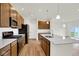 Well-equipped kitchen with stainless steel appliances, quartz countertops, and modern fixtures at 19123 River Jordan Pass, Westfield, IN 46074