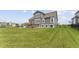 Back of house showcasing the yard, deck and hot tub at 19405 Titus Dr, Westfield, IN 46074