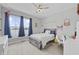 Comfortable bedroom with a large window, ceiling fan, and cozy swing at 19405 Titus Dr, Westfield, IN 46074