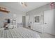 Well-lit bedroom with a decorative desk, ceiling fan and neutral-toned carpet at 19405 Titus Dr, Westfield, IN 46074