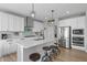 Stylish kitchen with modern island seating, stainless steel appliances, and sleek design for culinary enthusiasts at 19405 Titus Dr, Westfield, IN 46074