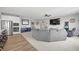 Spacious living room with ample seating, modern decor, and seamless flow to the kitchen and dining areas at 19405 Titus Dr, Westfield, IN 46074