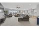 Open-concept living room with cozy seating, plenty of natural light, and seamless flow to the kitchen at 19405 Titus Dr, Westfield, IN 46074