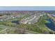 Aerial view of a golf course community with lush landscaping, ponds, and well-maintained homes at 19702 Tomlinson Rd, Westfield, IN 46074