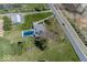 A large grass yard surrounds a single-Gathering house with an in-ground swimming pool and a long driveway at 19702 Tomlinson Rd, Westfield, IN 46074