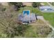 Aerial view of a residential home with a swimming pool, surrounded by greenery and trees at 19702 Tomlinson Rd, Westfield, IN 46074