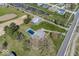 Sprawling property featuring a home, swimming pool, outbuilding, and a serene pond, perfect for outdoor enjoyment at 19702 Tomlinson Rd, Westfield, IN 46074