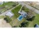 View of a home with a pool and outbuilding surrounded by expansive, well-maintained lawn and mature trees at 19702 Tomlinson Rd, Westfield, IN 46074