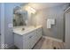 Modern bathroom featuring double sinks, white cabinets, and a glass-enclosed shower at 19702 Tomlinson Rd, Westfield, IN 46074