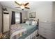 Comfortable bedroom with ceiling fan and ample natural light from the window at 19702 Tomlinson Rd, Westfield, IN 46074