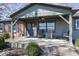 Inviting covered front porch with rocking chairs and ample seating at 19702 Tomlinson Rd, Westfield, IN 46074