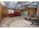 Spacious garage with large door, truck, and ATV at 19702 Tomlinson Rd, Westfield, IN 46074