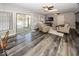 Bright living room features hardwood floors, ceiling fans, and access to the outdoor pool area at 19702 Tomlinson Rd, Westfield, IN 46074