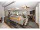 Open living room with laminate floors, skylights, and bright lighting at 19702 Tomlinson Rd, Westfield, IN 46074
