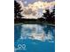 Sparkling pool with clear blue water under a picturesque sky with reflective clouds at 19702 Tomlinson Rd, Westfield, IN 46074