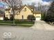 Charming home with attached garage, showcasing lush green lawn and inviting driveway at 1984 Telfair St, Carmel, IN 46032