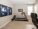 Home gym with treadmill, weights, and sports memorabilia for a motivational workout space at 20133 Willenhall Way, Westfield, IN 46074