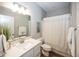 Bright bathroom featuring a vanity with storage, stylish mirror, and shower with a decorative curtain at 20133 Willenhall Way, Westfield, IN 46074