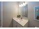 Modern bathroom with a sleek vanity, quartz countertop, stylish mirror, and contemporary light fixture at 20133 Willenhall Way, Westfield, IN 46074