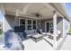 A covered patio featuring comfortable seating, a ceiling fan, and a stainless steel grill at 20133 Willenhall Way, Westfield, IN 46074