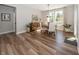 Dining room features natural light, modern decor, and a charming chandelier, offering a welcoming ambiance at 20133 Willenhall Way, Westfield, IN 46074