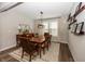 Elegant dining room with a wooden table, stylish decor, and ample natural light for memorable gatherings at 20133 Willenhall Way, Westfield, IN 46074