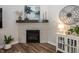 Stylish fireplace with tile surround, a decorative mantel, and elegant accents for a cozy focal point at 20133 Willenhall Way, Westfield, IN 46074
