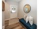 Cozy foyer with a comfortable bench, decorative mirror, and stylish flooring, creating a welcoming ambiance at 20133 Willenhall Way, Westfield, IN 46074