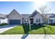 Charming single-story home with a well-manicured lawn and attached garage in a tranquil neighborhood at 20133 Willenhall Way, Westfield, IN 46074