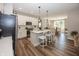 Charming kitchen features modern appliances, an island with seating, and open sight lines into the dining area at 20133 Willenhall Way, Westfield, IN 46074