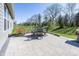 This outdoor patio features a dining table with seating and beautiful landscaping at 20133 Willenhall Way, Westfield, IN 46074