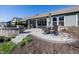 Beautifully designed patio with seating, outdoor cooking area, and professional landscaping for outdoor enjoyment at 20133 Willenhall Way, Westfield, IN 46074