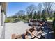 Spacious outdoor patio with dining and seating areas, and a stone fire pit perfect for gatherings at 20133 Willenhall Way, Westfield, IN 46074