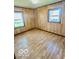 Comfortable bedroom featuring wood-look flooring, neutral walls, and natural light at 213 Harrell Dr, Edinburgh, IN 46124
