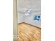 Bedroom with light wood-look floors, modern ceiling fan, and natural light at 213 Harrell Dr, Edinburgh, IN 46124