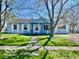 Charming single-story home with light blue siding and well-manicured lawn at 213 Harrell Dr, Edinburgh, IN 46124