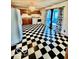 Cozy kitchen with black and white checkered floors, wooden cabinets, and matching appliances at 213 Harrell Dr, Edinburgh, IN 46124