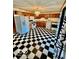 Charming kitchen featuring checkered flooring, wooden cabinetry, and modern appliances at 213 Harrell Dr, Edinburgh, IN 46124