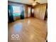 Bright living room featuring hardwood floors and natural light from large windows at 213 Harrell Dr, Edinburgh, IN 46124