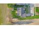 This aerial view captures a home with mature trees and a spacious lawn surrounded by agricultural fields at 2511 Countryside Westview Dr, Shelbyville, IN 46176
