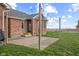 An outdoor patio with new string lights and beautiful green lawn, perfect for entertaining or relaxing at 2511 Countryside Westview Dr, Shelbyville, IN 46176