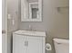 Bathroom featuring a white vanity with a marble countertop, complemented by neutral walls and modern fixtures at 2511 Countryside Westview Dr, Shelbyville, IN 46176