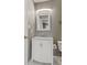 This bathroom features a white vanity with a marble countertop, complemented by neutral walls and modern fixtures at 2511 Countryside Westview Dr, Shelbyville, IN 46176
