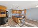 Well-lit kitchen featuring wood cabinets, a blue island, stainless steel appliances, and ample counter space at 2511 Countryside Westview Dr, Shelbyville, IN 46176