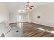 Living room with hardwood floors, ample natural light, and a ceiling fan at 2511 Countryside Westview Dr, Shelbyville, IN 46176