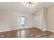 Inviting living room with hardwood floors and a decorative glass front door at 2511 Countryside Westview Dr, Shelbyville, IN 46176